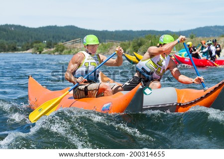 CASCADE, IDAHO/USA - JUNE 21, 2014: Boaters 17 and 54 test the waters at the Payette River Games