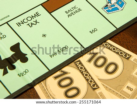 BOISE, IDAHO - NOVEMBER 18, 2012: Income tax time if you land on this spot for the game Monopoly made by Hasbro