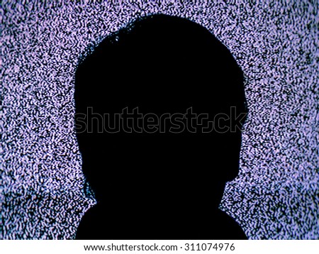 Image of a man\'s head in front of a static filled TV
