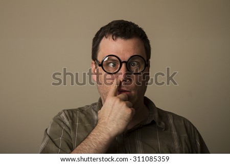 Man out there with crossed eyes and glasses picking his nose