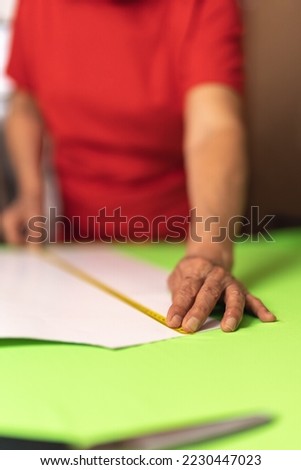 Image, Stock Photo Anonymous woman taking measurements in a wired dummy