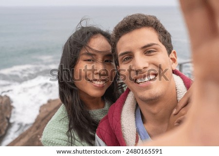 Similar – Image, Stock Photo Loving young couple taking selfie on street