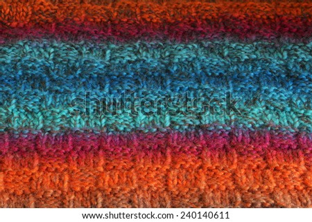 Wool texture. Fragment of wool handmade scarf.