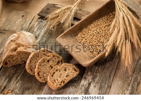 Bread.Rye-bread on the wooden boards.Rye seeds and  ears.