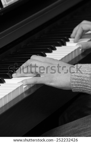 Pianist. Hands of boy,which studies play on the piano.