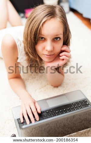 Portrait of a happy girl with laptop computer