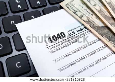 Individual tax return form on a laptop keyboard