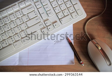 pencil message and keyboard with computer mouse on wooden table
