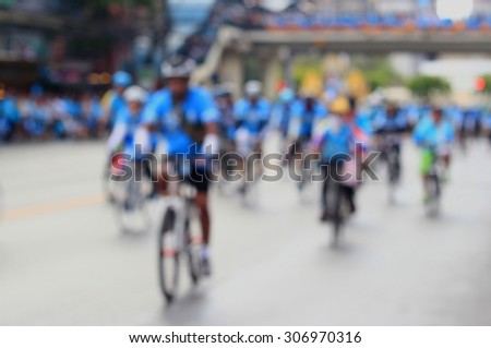 People cycling together in the event BIKE FOR MOM(Blur image of asphalt road and bike for background usage)