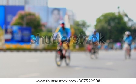 People cycling together in the event BIKE FOR MOM(Blur image of asphalt road and bike for background usage)