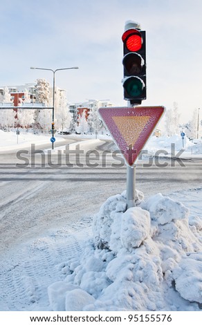 Red traffic light at winter