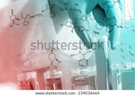 Gloved hand holding the test tubes, with chemical equations background,  in the laboratory