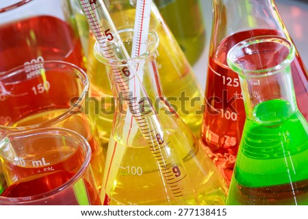 Colorful of the solution in laboratory glassware, flask beaker and pipette for science and technology concept.