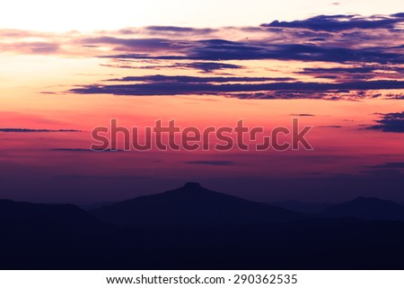 The landscape photo, silhouette of mountain and sky at sunrise/ sunset viewpoint