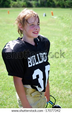 Young boy after winning American youth football game