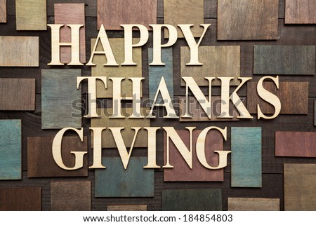 Wooden letters forming words HAPPY THANKS GIVING written on wooden background