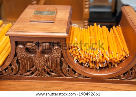 ARISTINO VILLAGE, GREECE - APRIL 30: Candles in the sheath, iconography in the interior of village church, on April 30, 2014 in Aristino Village, Greece