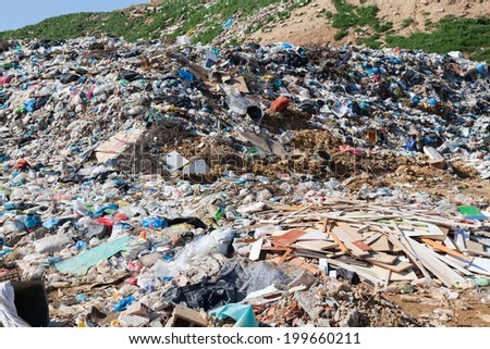 ALEXANDROUPOLIS, GREECE - MARCH 30: A section of a landfill located on March 30, 2014 in Alexandroupolis, Greece. Though forbidden this way for the municipality garbage, still exists.