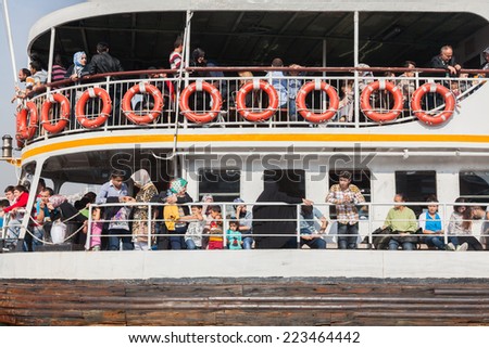 ISTANBUL - OCTOBER 7: People get on board the ship at Eminonu on October 7, 2014 in Istanbul. Nearly 150,000 passengers use ferries daily in Istanbul, due to easy access to two different continents.