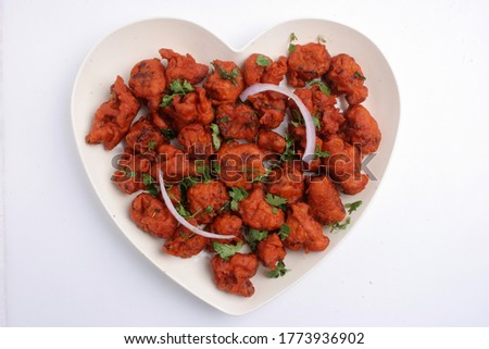 Chicken 65 is a spicy, deep-fried chicken dish originating from Hotel Buhari, Chennai, India, as an entrée, or quick snack. The flavour of the dish can be attributed to red chillies. Сток-фото © 