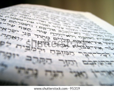 the bible and glasses macro photo of the hebrew letters