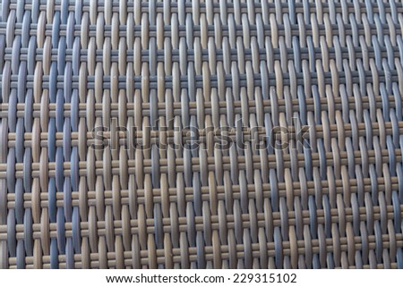 Synthetic rattan texture weaving background as used on outdoor garden furniture.