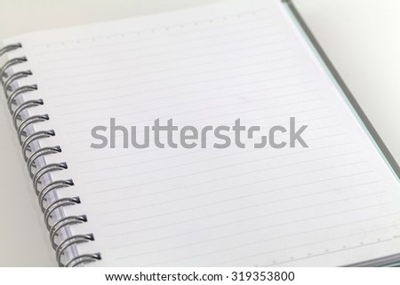 White spiral emty notebook on white background