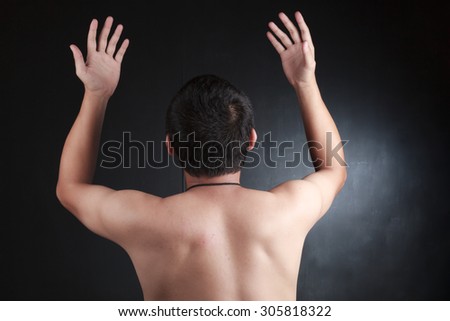 Naked man with his back turned