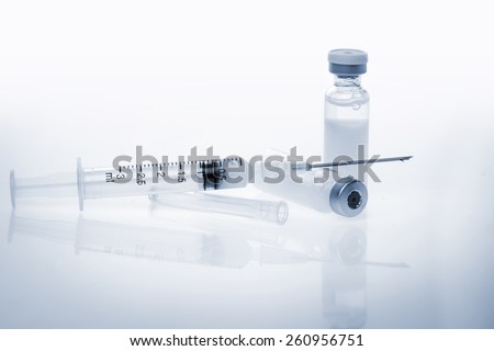 Glass Medicine Vials with botox, hualuronic, collagen or flu Syringe  (shallow DOF)