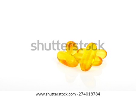 Evening primrose oil or fish oil capsules on white background.