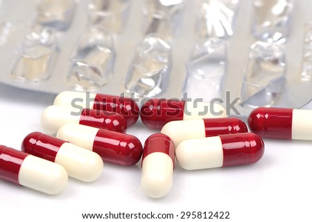 Pills. Red and White and blister pack, Isolated on White Background