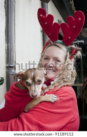 LOS ANGELES - DECEMBER 17: Unidentified participant with dog at Santa Claus parade on December 17, 2011 in Los Angeles