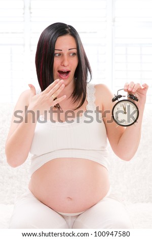 frightened pregnant woman anticipating childbirth ambulances