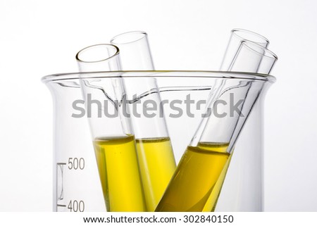 Test tube with yellow(urine) liquid(fluid, water) in the beaker for chemical, health, urology at the laboratory and white background.