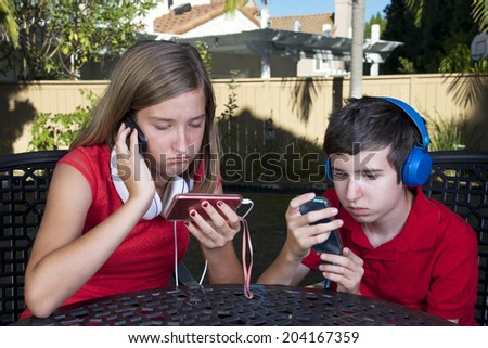 kids with technology phone game system music social media