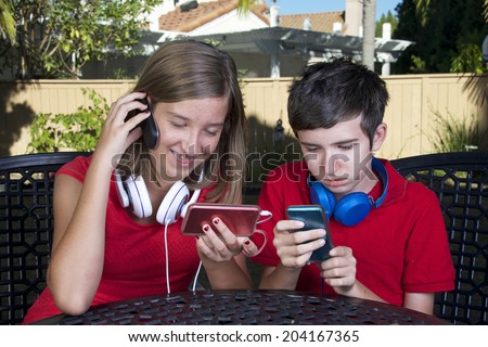 kids with technology phone game system music social media