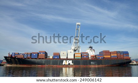 OAKLAND, CA - FEBRUARY 01, 2015: APL Cargo Ship CHINA loading at the Port of Oakland. American President Lines Ltd is the world's seventh largest ocean carrier.
