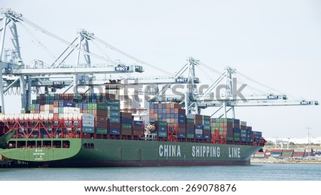 SAN PEDRO, CA - APRIL 10, 2015: China Shipping Cargo Ship XIN FEI ZHOU loading at the Port of Los Angeles. The Port of LA is the busiest container port in the United States.