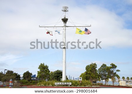 OAKLAND, CA - JULY 13, 2015: Flagpole at the entrance to Middle Harbor Shoreline Park,  a 38 acre shoreline park built and operated by the Port of Oakland for the community.