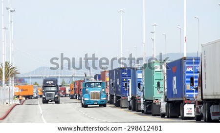 OAKLAND, CA - JULY 20, 2015: Hundreds of trucks line Middle Harbor Road waiting to enter the docks at the Port of Oakland.