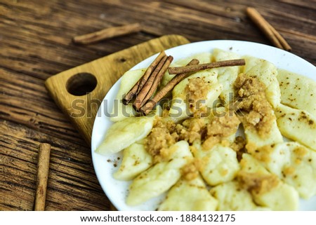 Traditional polish cheese dumplings with butter and cynamon. Stok fotoğraf © 
