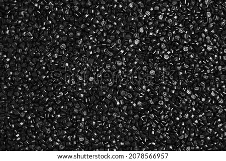 Many black and gray granules of polypropylene, polyamide. Background. Plastic and polymer industry, industry. Microplastic products. Foto d'archivio © 