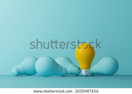 Light bulb yellow outstanding among lightbulb light blue on same color background. Concept of creative idea and innovation, Unique, Think different, standing out from the crowd. 3d illustration Photo stock © 