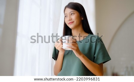 Similar – Image, Stock Photo Asian woman with coffee talking smartphone at cafe table