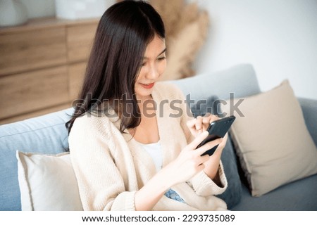 Similar – Image, Stock Photo Woman texting on smartphone while walking on sidewalk