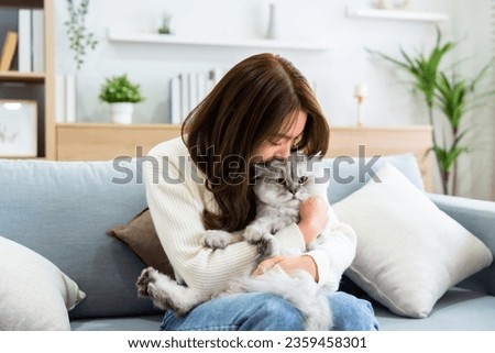 Similar – Image, Stock Photo Young woman hugging cat in hallway