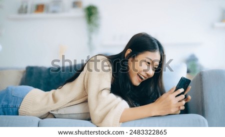Similar – Image, Stock Photo Asian woman with smartphone making up lips in cafe