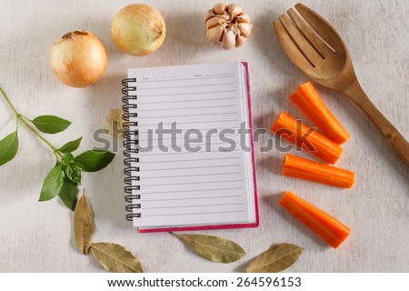 Organic vegetable and spice ingredient for cooking , food background with notepad for copy space, comfort food project or healthy food project