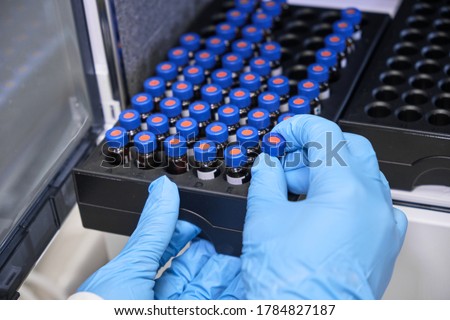 Similar – Image, Stock Photo Vials with scientific samples arranged on glass table