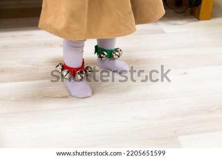 Adorable baby feet with hand bells on them Foto stock © 